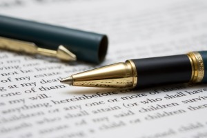 Photo of a pen and a page of legal language